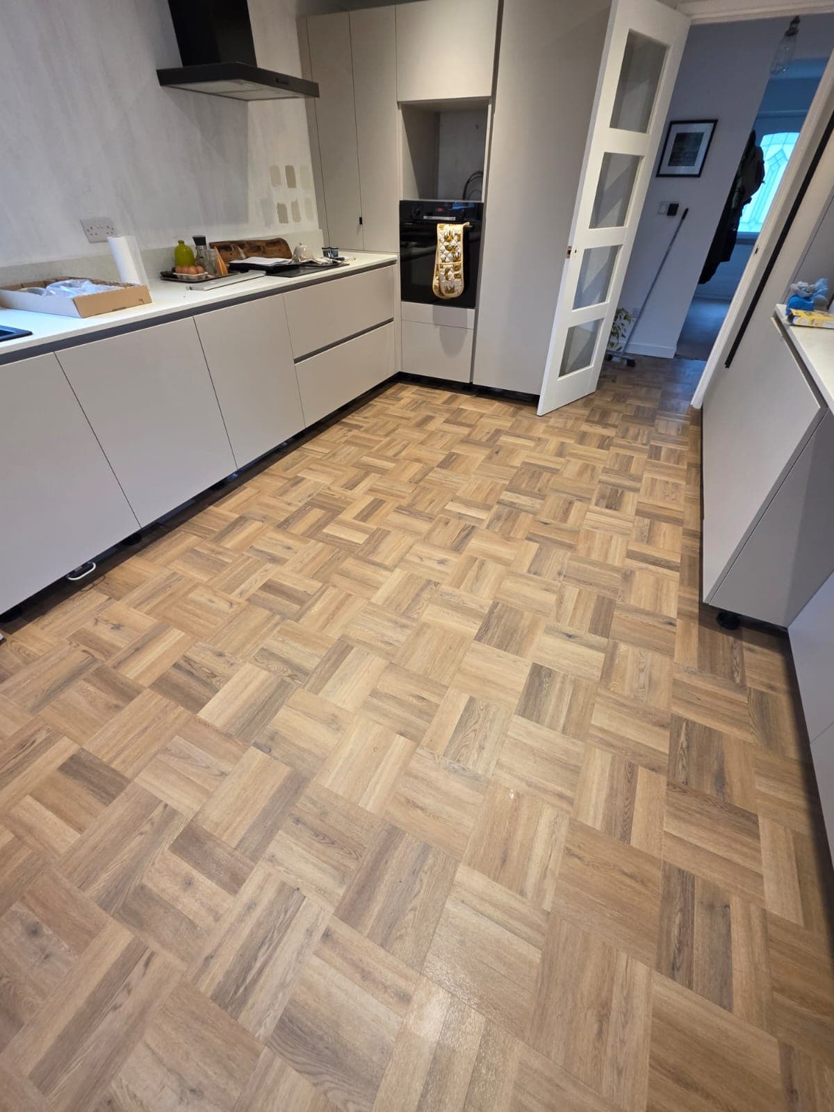 Herringbone luxury vinyl tile kitchen flooring